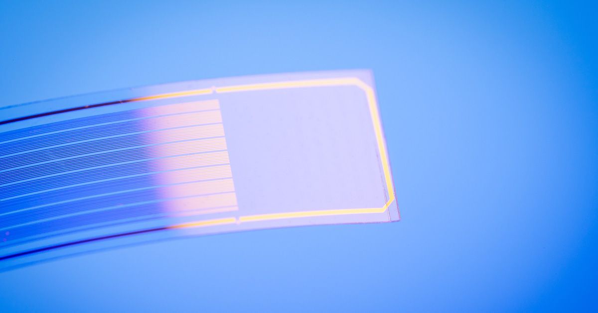 Transparent rectangular strip with gold stripes against a blue background.
